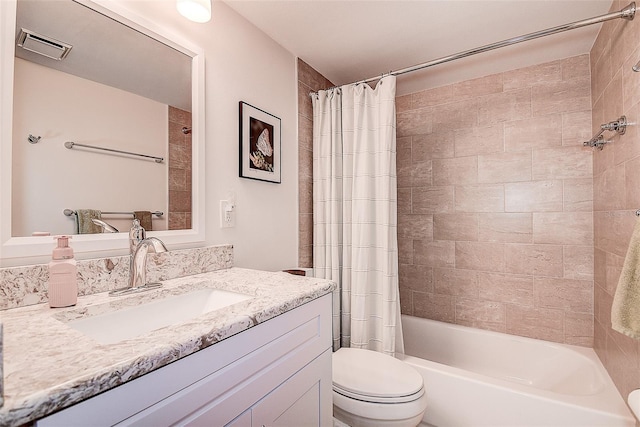 full bathroom featuring vanity, toilet, and shower / tub combo with curtain