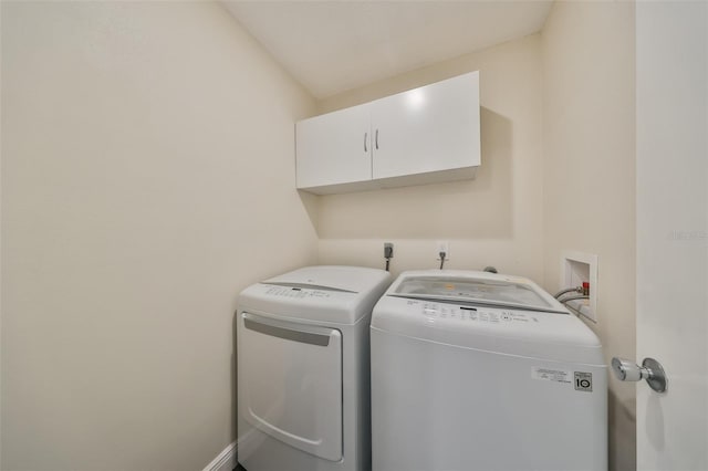 laundry room featuring cabinets and independent washer and dryer