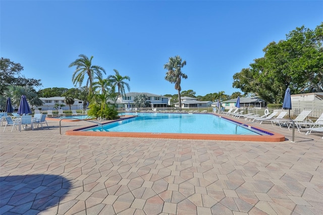 view of swimming pool featuring a patio