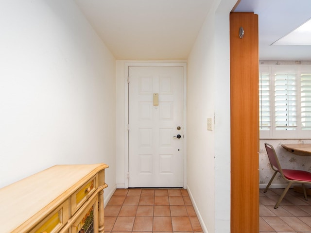 entryway with light tile patterned floors