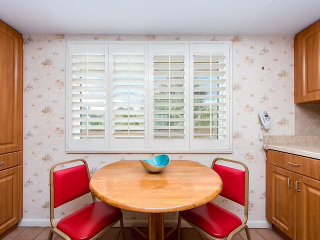 dining room with light tile patterned floors and a wealth of natural light