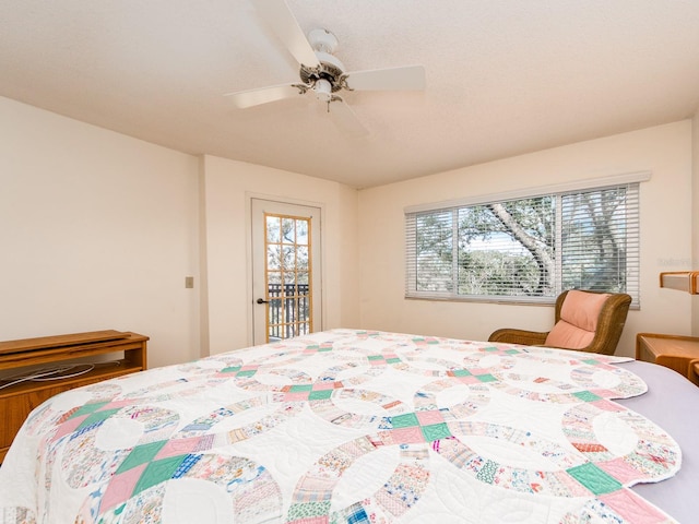 bedroom featuring access to outside and ceiling fan