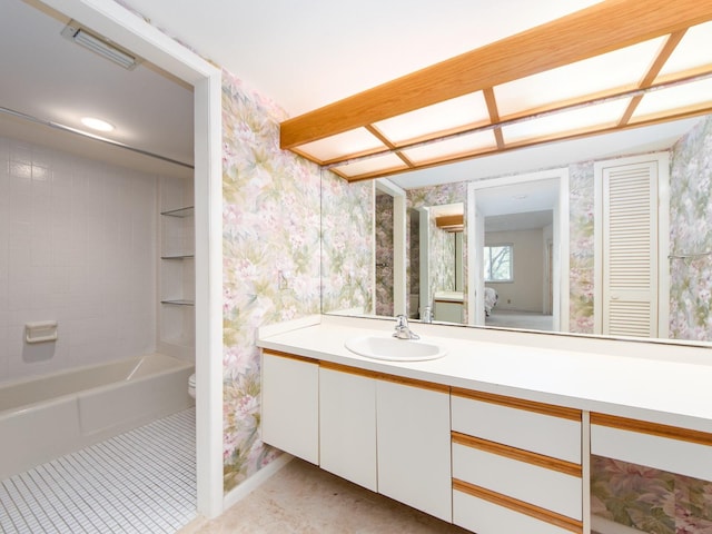 full bathroom featuring vanity, toilet, and tiled shower / bath combo