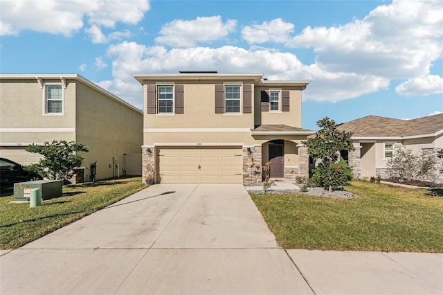 view of front of home with a front lawn and a garage