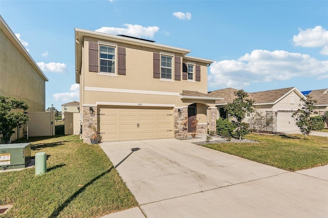 view of front of house featuring a front yard and a garage