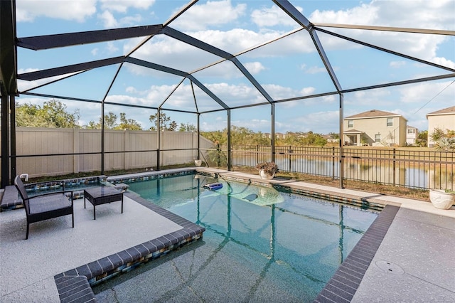 view of pool with a fenced in pool, a patio area, glass enclosure, and a water view