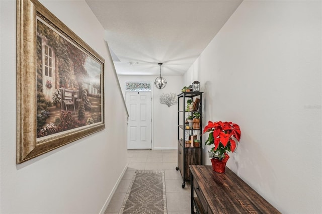 corridor with light tile patterned flooring