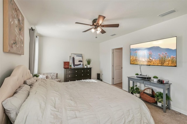 bedroom featuring light carpet and ceiling fan