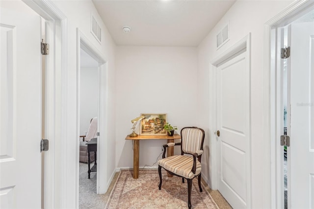 sitting room with light colored carpet