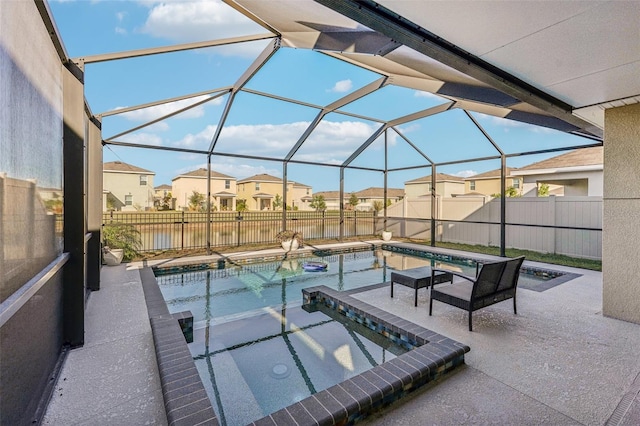 view of pool with a lanai and a patio area