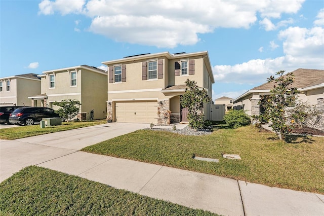 view of front of property featuring a garage and a front lawn