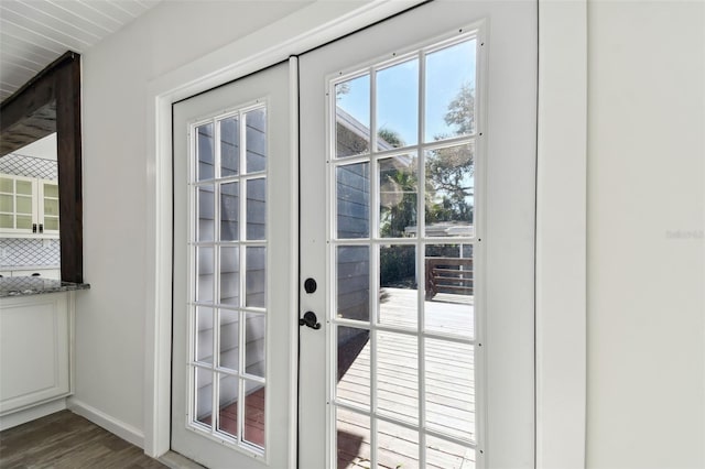 doorway to outside with french doors and dark hardwood / wood-style floors