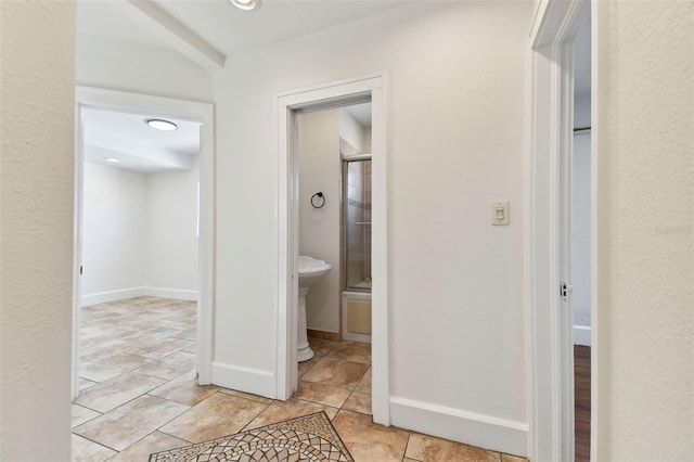 hallway featuring light tile patterned floors