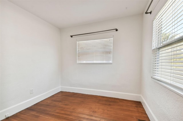 unfurnished room featuring hardwood / wood-style floors