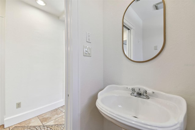 bathroom with tile patterned floors and sink