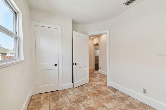 unfurnished bedroom featuring light tile patterned floors