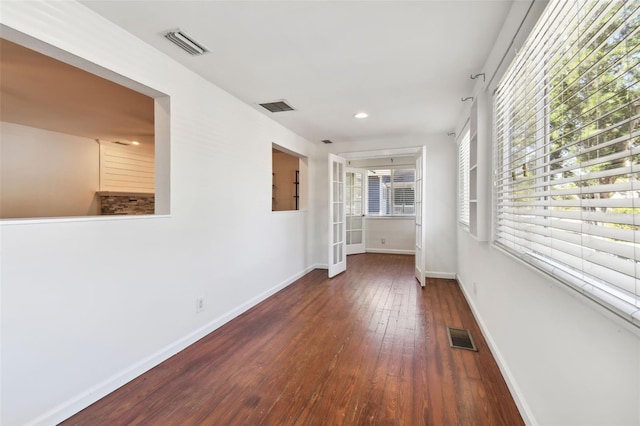 hallway featuring dark wood-type flooring