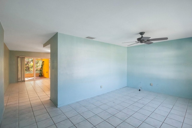 unfurnished room featuring ceiling fan and light tile patterned floors