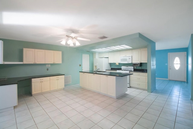 kitchen with ceiling fan, sink, kitchen peninsula, white appliances, and light tile patterned floors