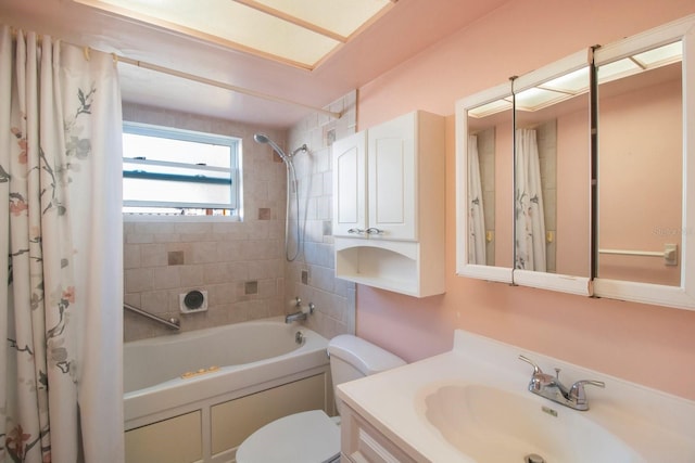 full bathroom with vanity, toilet, and shower / tub combo with curtain