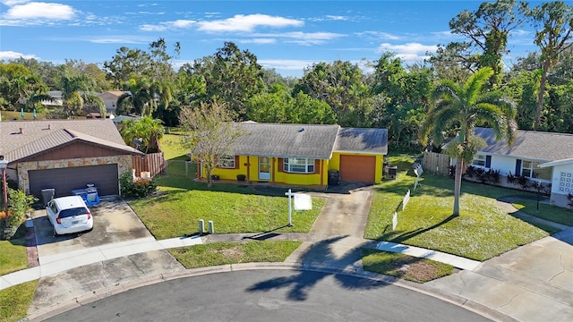 view of front of home with a garage and a front yard