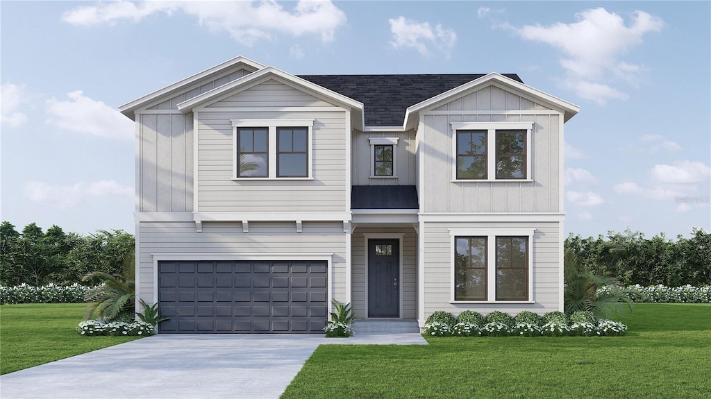 view of front facade with a garage and a front lawn