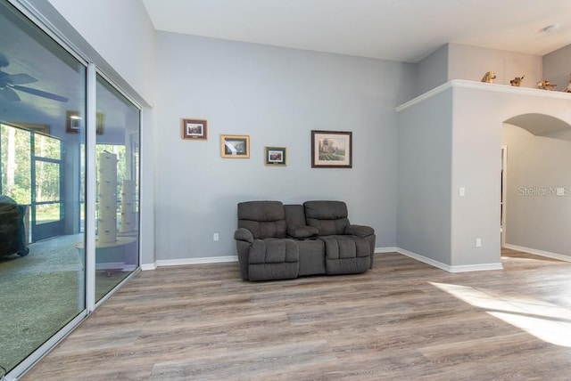 sitting room with light hardwood / wood-style flooring and ceiling fan