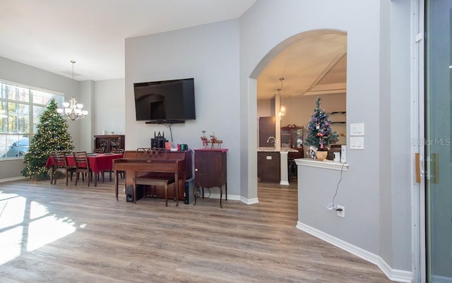 interior space featuring a notable chandelier and hardwood / wood-style flooring