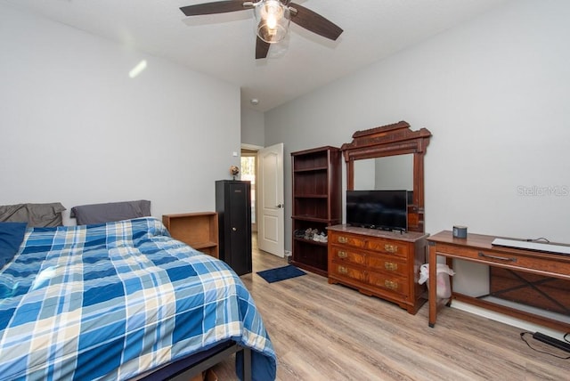 bedroom with light hardwood / wood-style flooring and ceiling fan