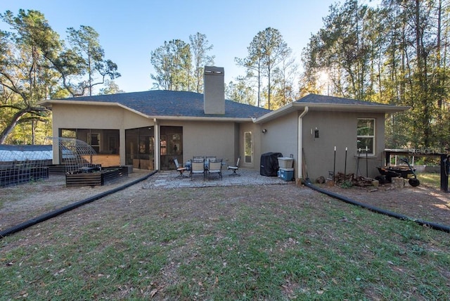 back of house featuring a patio area