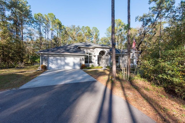 ranch-style home with a garage