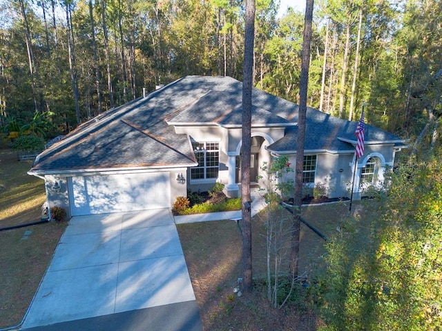 single story home with a garage