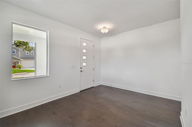 entryway with dark hardwood / wood-style flooring