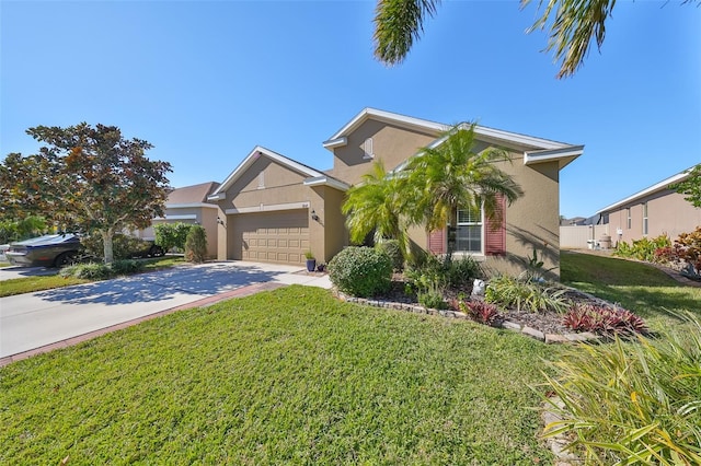 view of front of house with a garage and a front yard