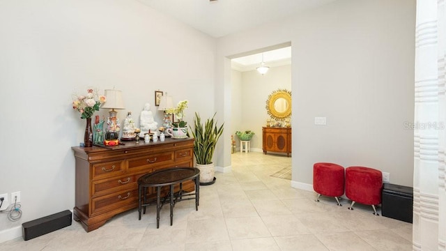 hall with light tile patterned flooring