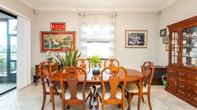 dining space with light tile patterned flooring, crown molding, and an inviting chandelier