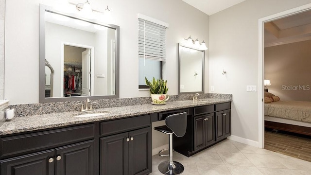 bathroom with vanity and tile patterned floors