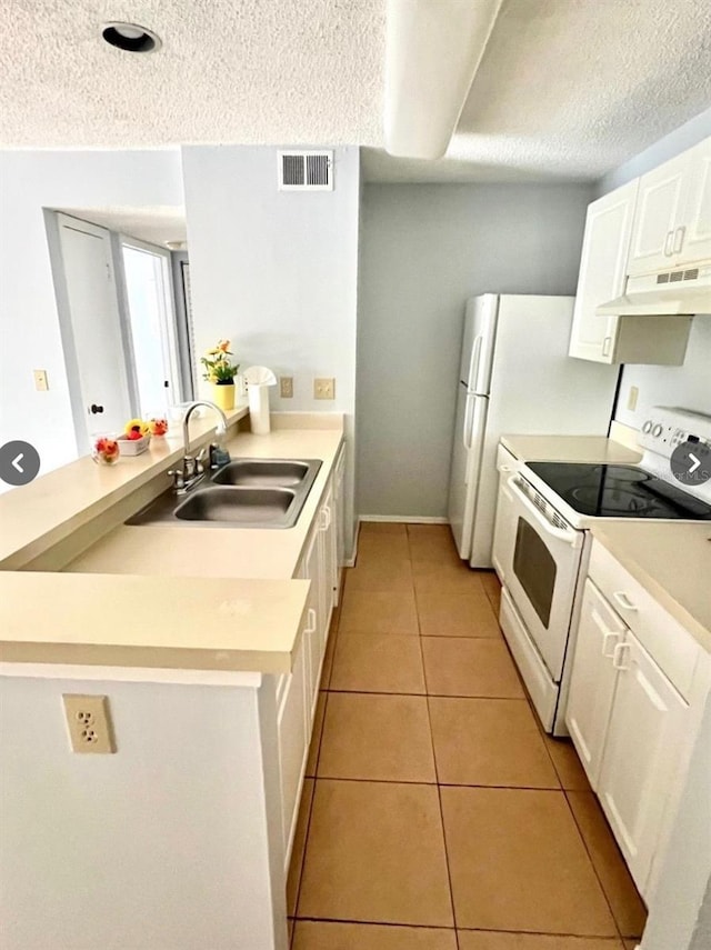 kitchen with visible vents, a sink, under cabinet range hood, white electric range oven, and light tile patterned floors