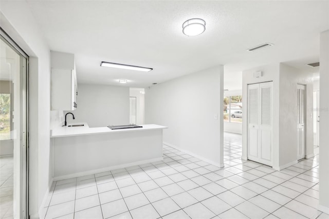 bathroom featuring tile patterned floors and sink