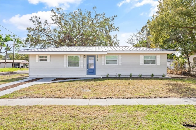 ranch-style home with a front lawn