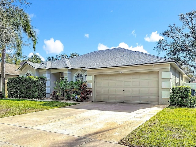 single story home with a front lawn and a garage