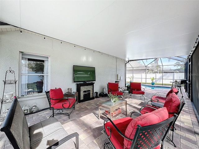 view of patio / terrace featuring outdoor lounge area, a lanai, and a fenced in pool