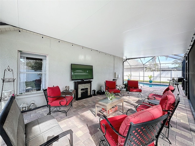 view of patio with a fenced in pool and glass enclosure