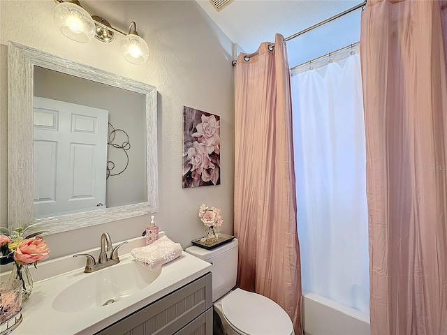 full bathroom with vanity, toilet, and shower / bath combo with shower curtain