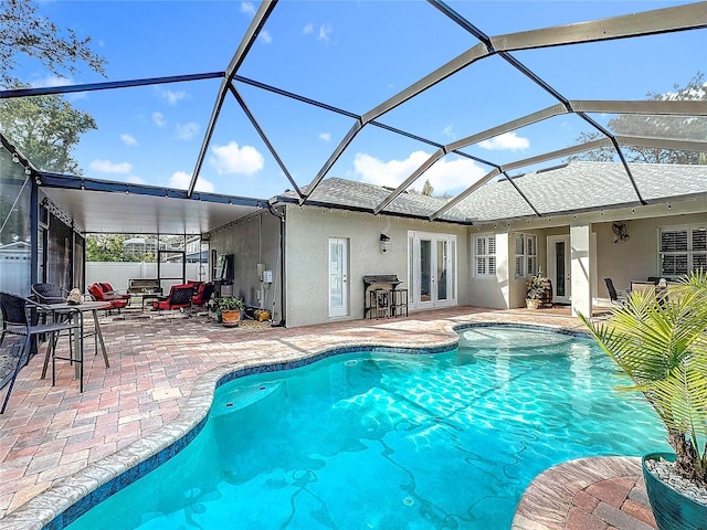 view of swimming pool with french doors, an outdoor living space, a lanai, and a patio area