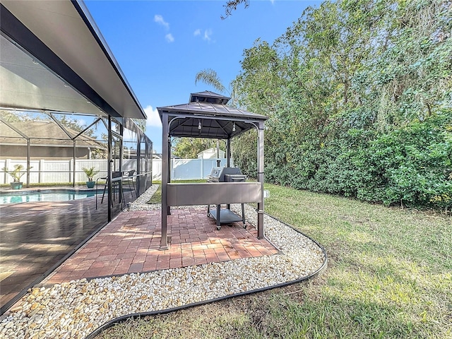 view of yard with a gazebo, a fenced in pool, and a patio