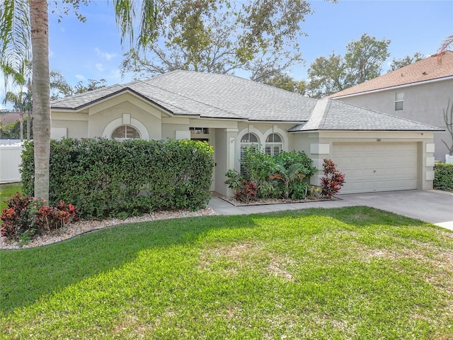 ranch-style house featuring a front lawn and a garage