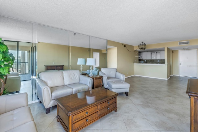 living room featuring a textured ceiling