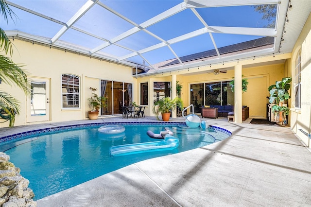 view of swimming pool with a patio, an outdoor hangout area, ceiling fan, and a lanai