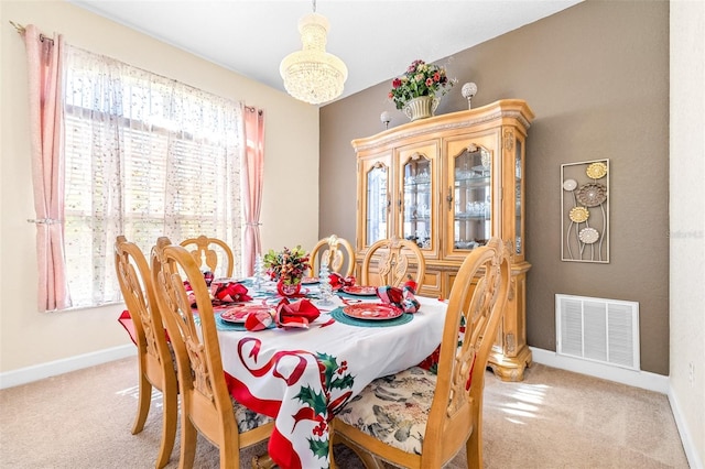 dining space featuring carpet flooring